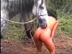 While sitting nude, the sultry amateur gets off the horse to sniff her ass and pussy.